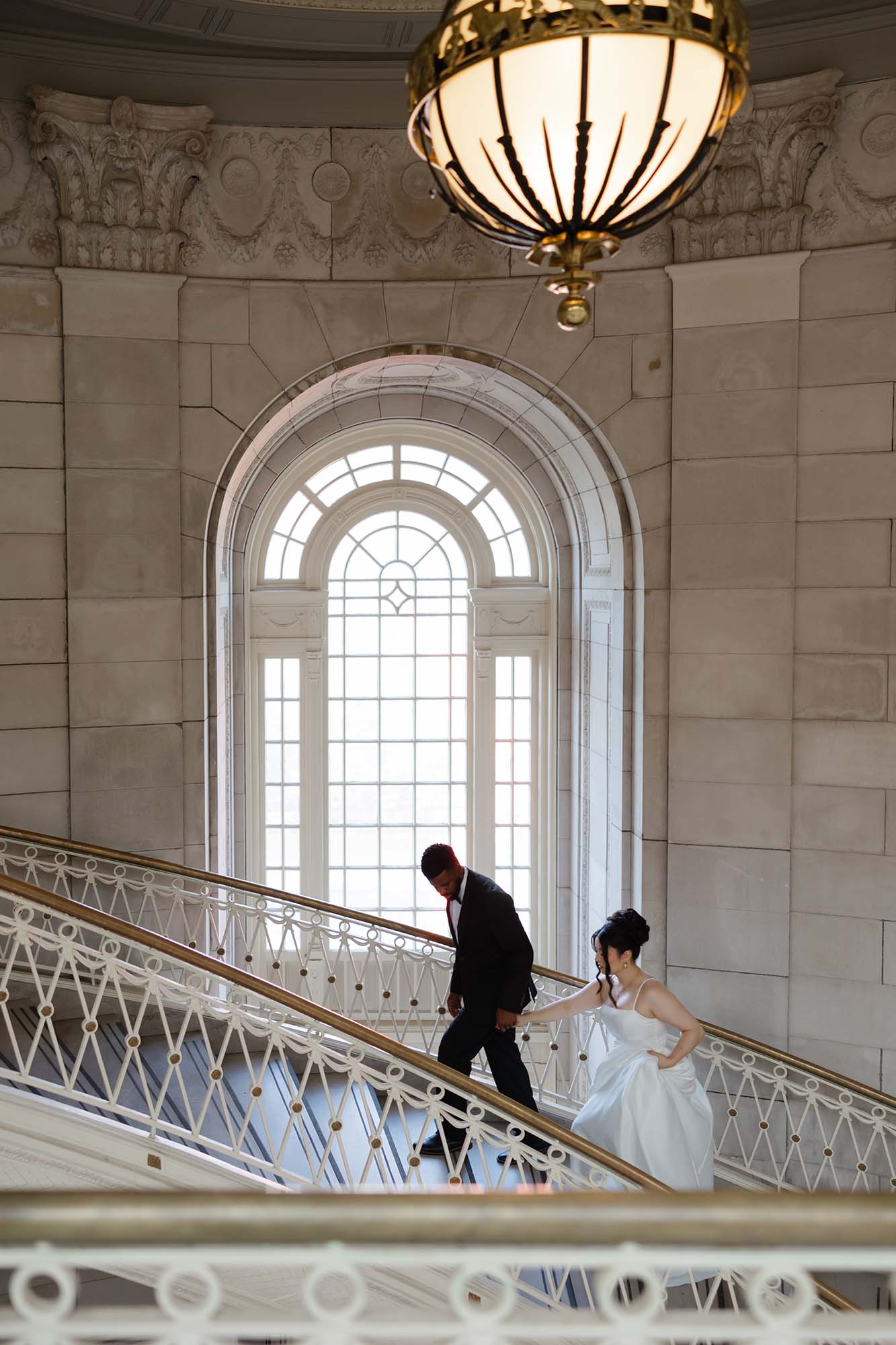OKC luxury wedding photography, bride and groom heading upstairs, by Rosie Cheeks Photography.