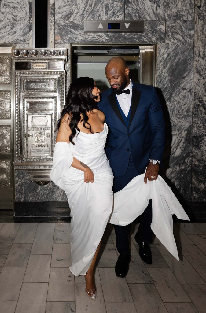 OKC luxury wedding photography, bride and groom exiting elevator, by Rosie Cheeks Photography.
